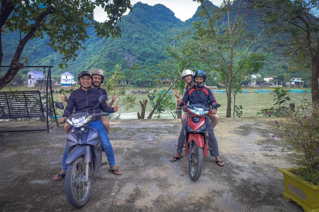 Two Easy Riders with tourists on the back of their motorbike in Phong Nha National Park