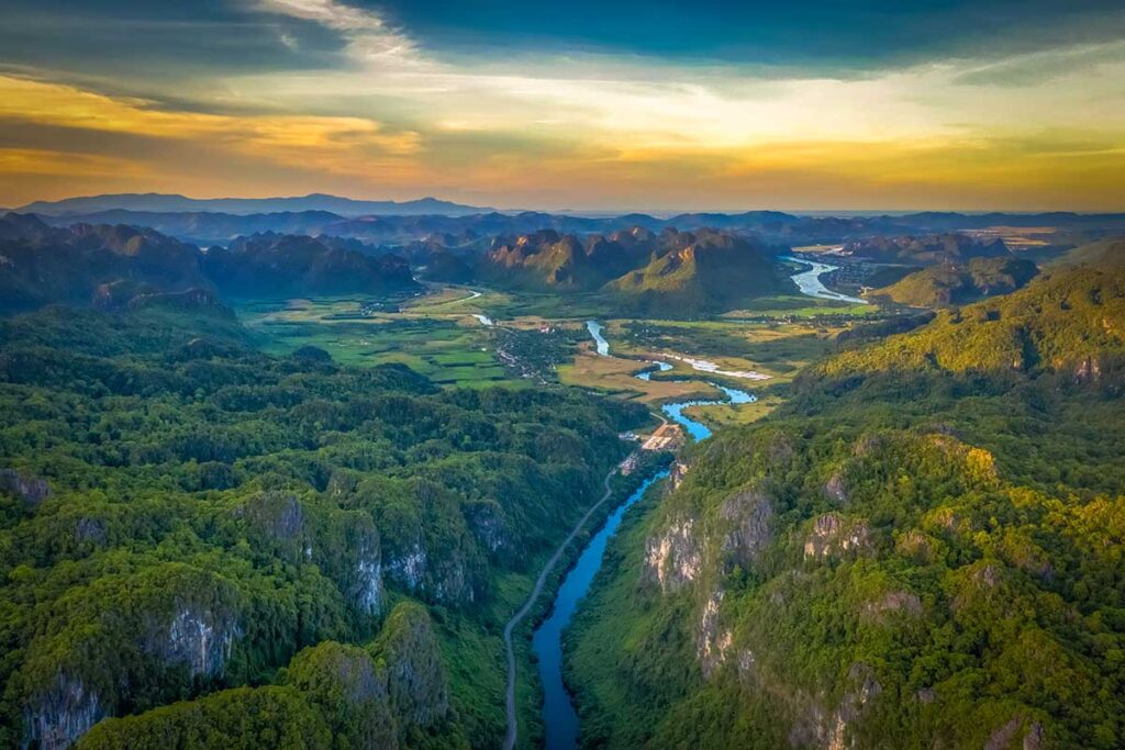 Epic aerial views over the jungle, river and mountains of Phong Nha-Ke Bang National Park 