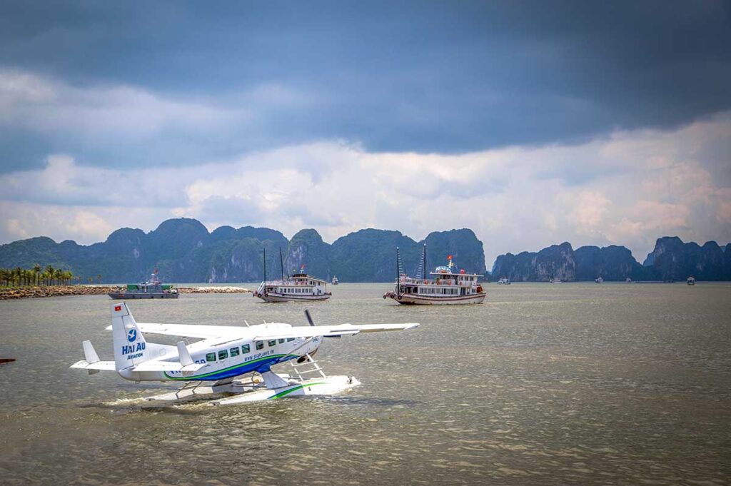 A sea plane taking off from the water in Halong Bay for a sightseeing flight