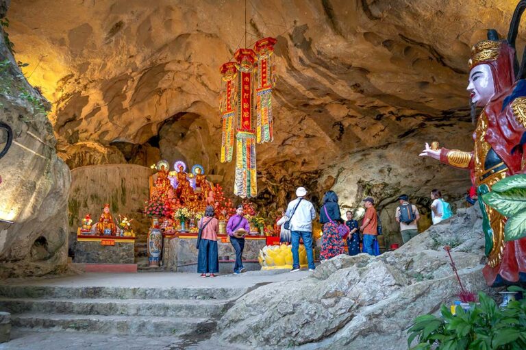 People praying at Tam Thanh Pagoda inside a cave in Lang Son