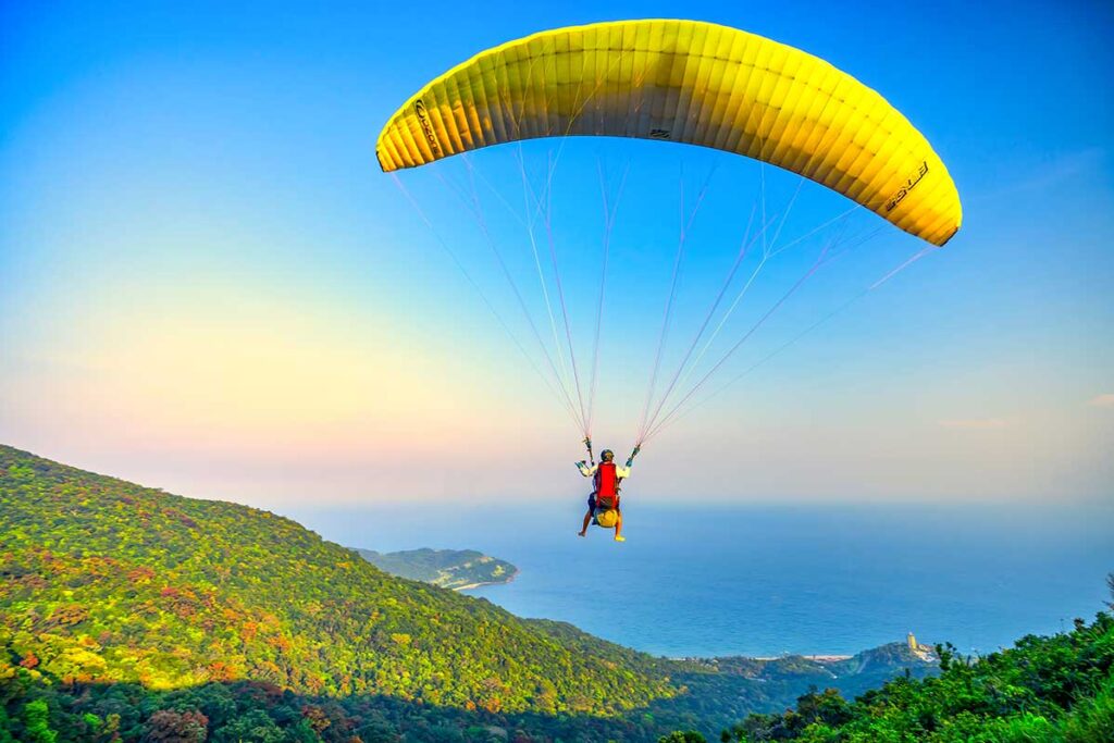 Vietnam paragliding over Son Tra Peninsula (Da Nang) with stunning coastline