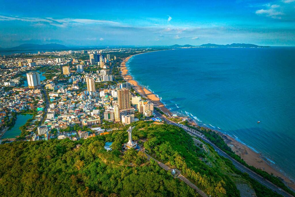 A view over Jesus Statue and the beach of Vung Tau Beach city in Vietnam, nearby Ho Chi Minh City