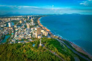 A view over Jesus Statue and the beach of Vung Tau Beach city in Vietnam, nearby Ho Chi Minh City