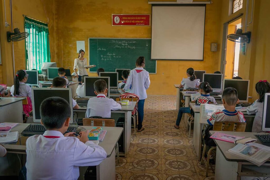 Vietnamese primary school classroom with students and a teacher, showing everyday school life in Vietnam.