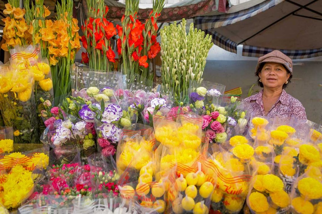 Flower stall in Vietnam selling bouquets commonly bought for Vietnamese Teachers’ Day.
