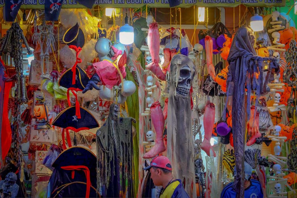 Halloween costumes and decorations displayed in a shop in Vietnam.