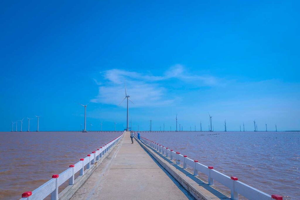 A windfarm seen from the shore in Bac Lieu Province
