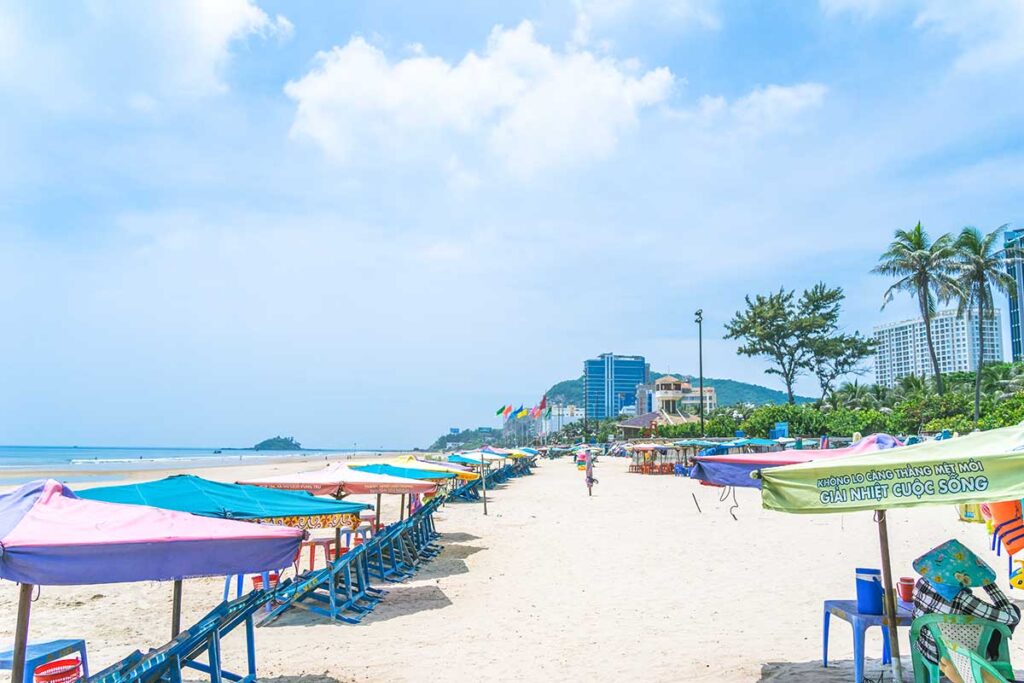 White sand and beach umbrellas on Back Beach of Vung Tau
