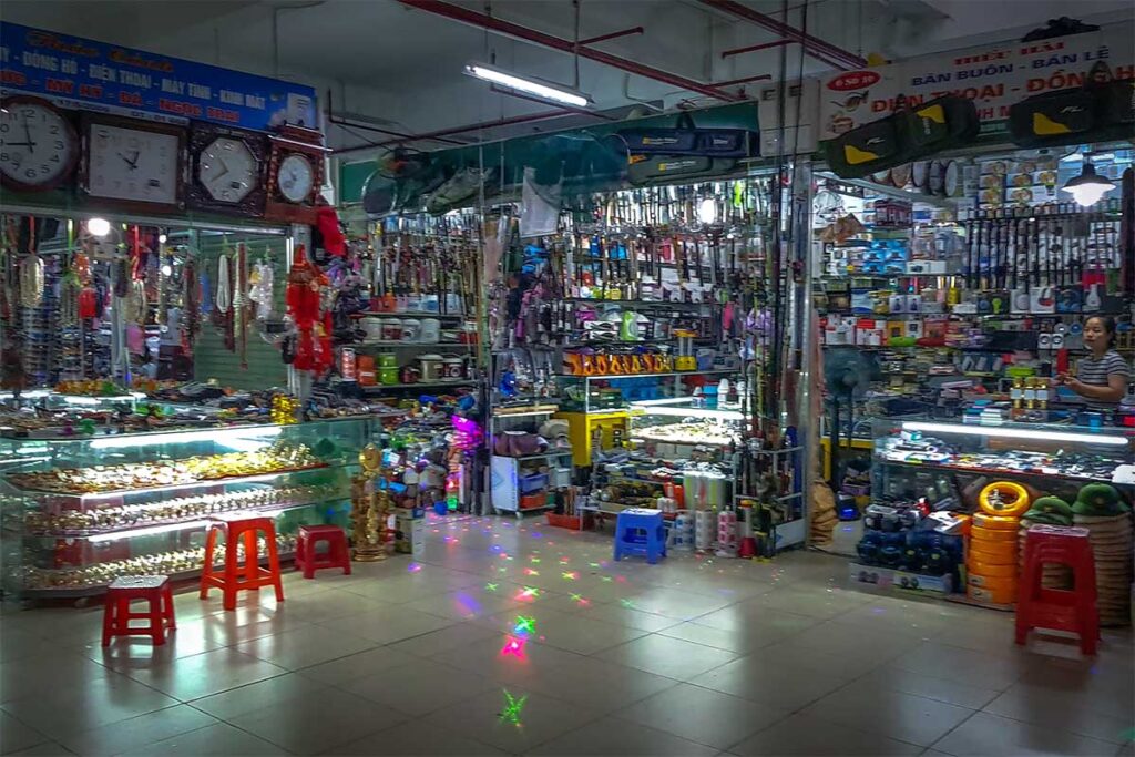 Different stalls selling local goods and imported products from China for daily use inside the Coc Leu Market in Lao Cai Town