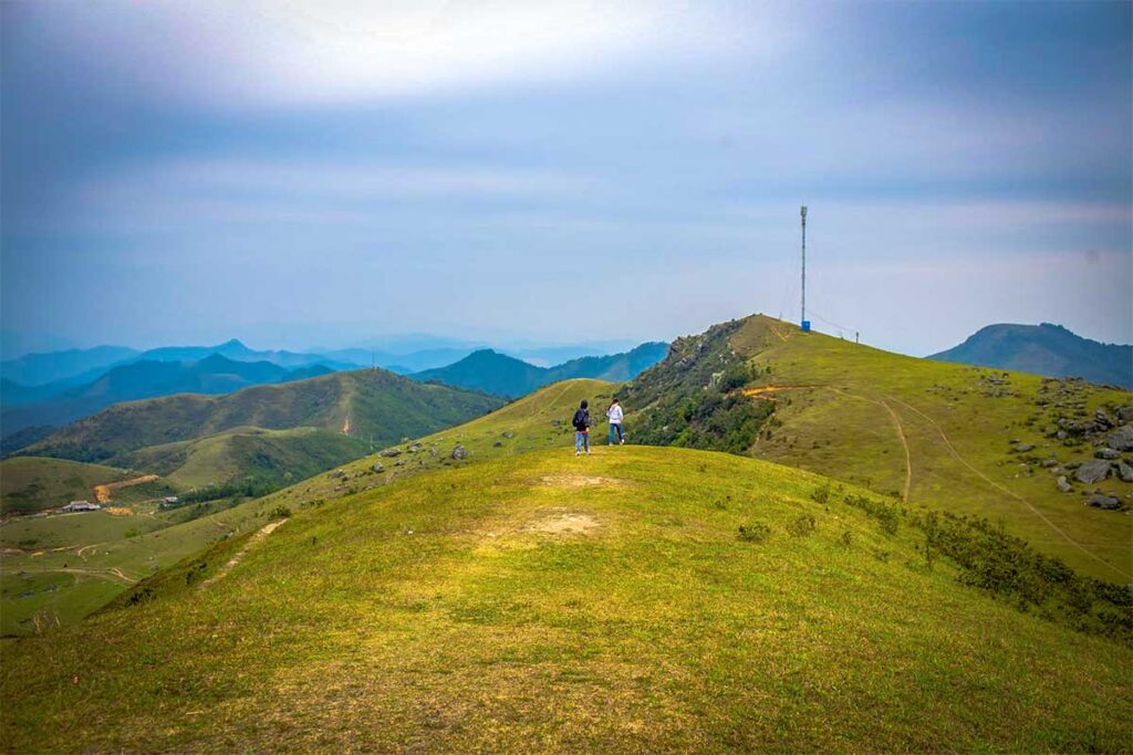 Two people trekking in Dong Cao Plateau in Bac Giang