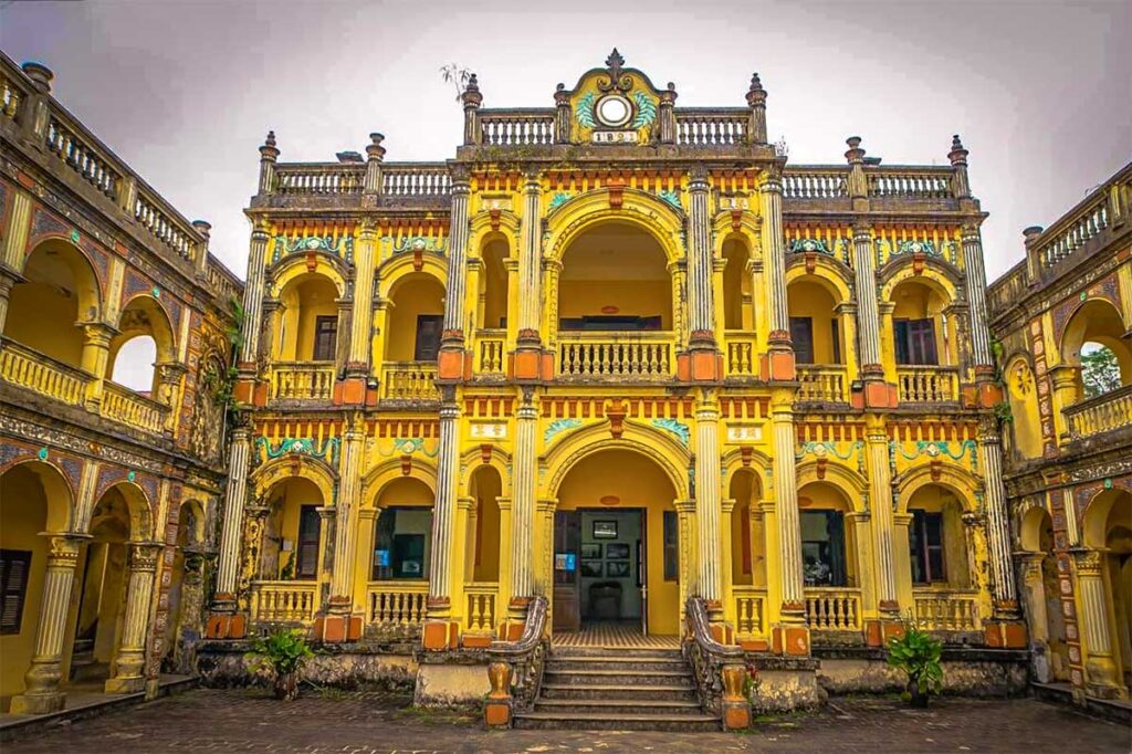 The indoor courtyard with yellow walls of Hoang A Tuong Palace in Ba Ha Town