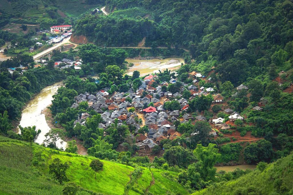 A charming village nestled in the valley, viewed from the scenic heights of Pha Din Pass.