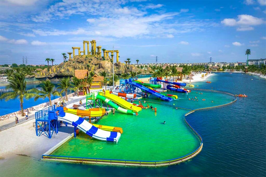 A artificial lake with small sandy beach and slides part of VinWonders Wave Park