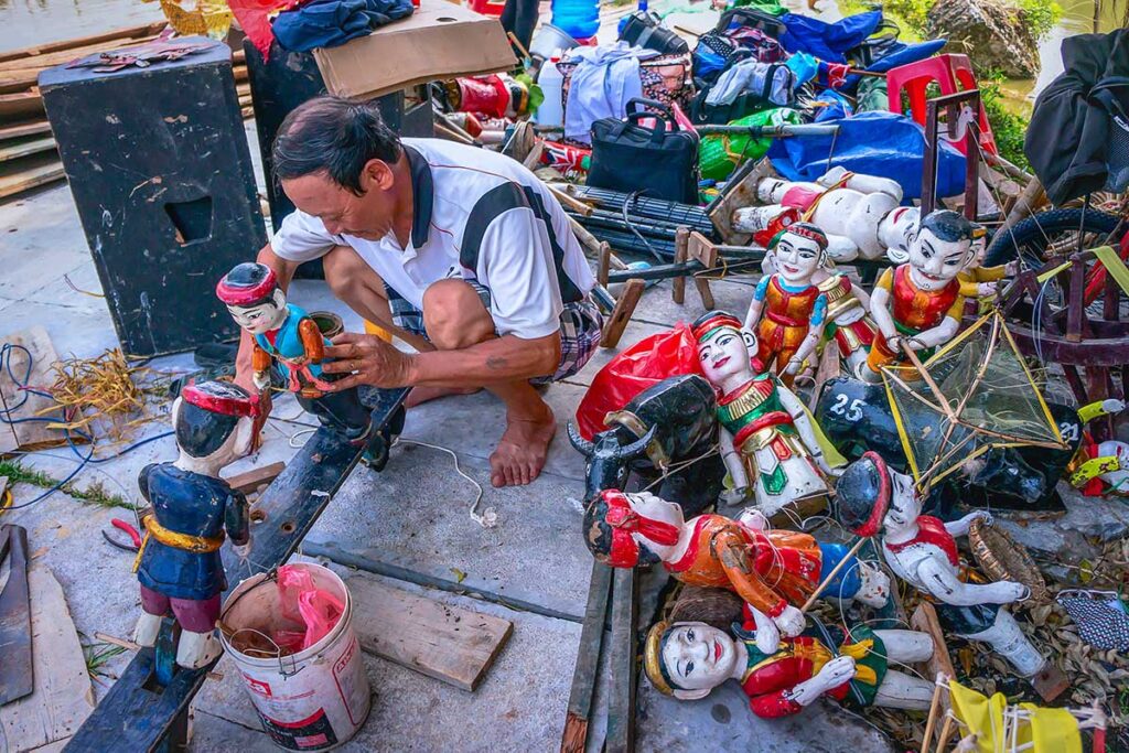 A local man is building water puppets at Water Puppet Village in Thanh Hai Commune
