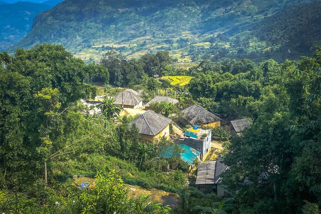 Viewed from a top of a mountain looking down on a local village in Y Ty with traditional mushroom-shaped houses