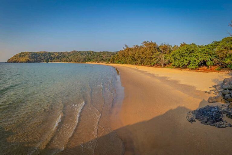 Quiet beach on Con Dao Island with clear water and untouched coastline, a remote island destination in Vietnam travel