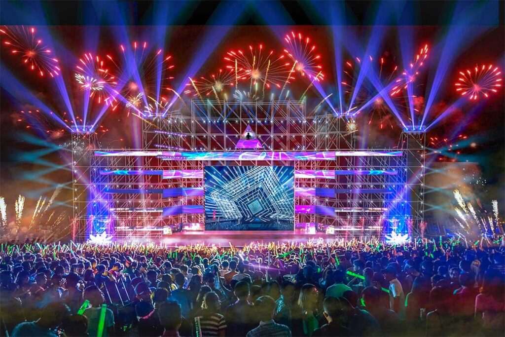 Large crowd with stage of music event during the countdown to New Year event in Hanoi