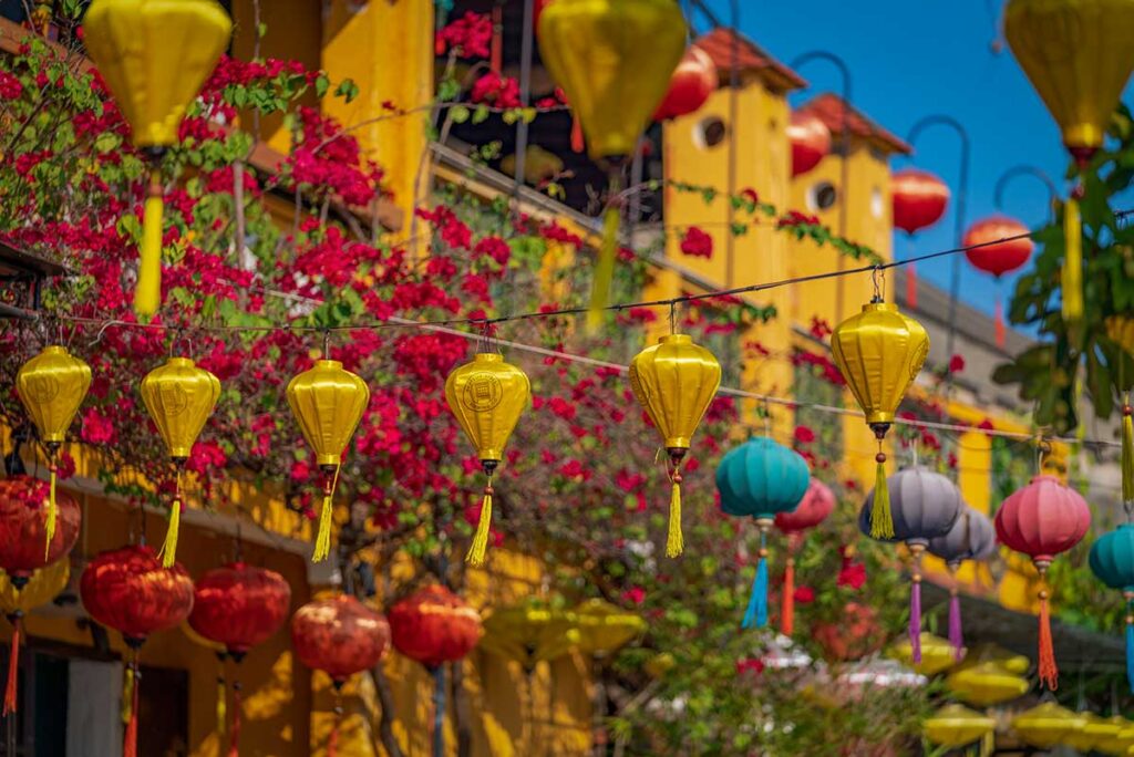 Colorful lanterns and bougainvillea under bright skies in Hoi An’s Ancient Town — a rare dry and sunny day during January, when the weather begins shifting from the rainy to the cooler season.