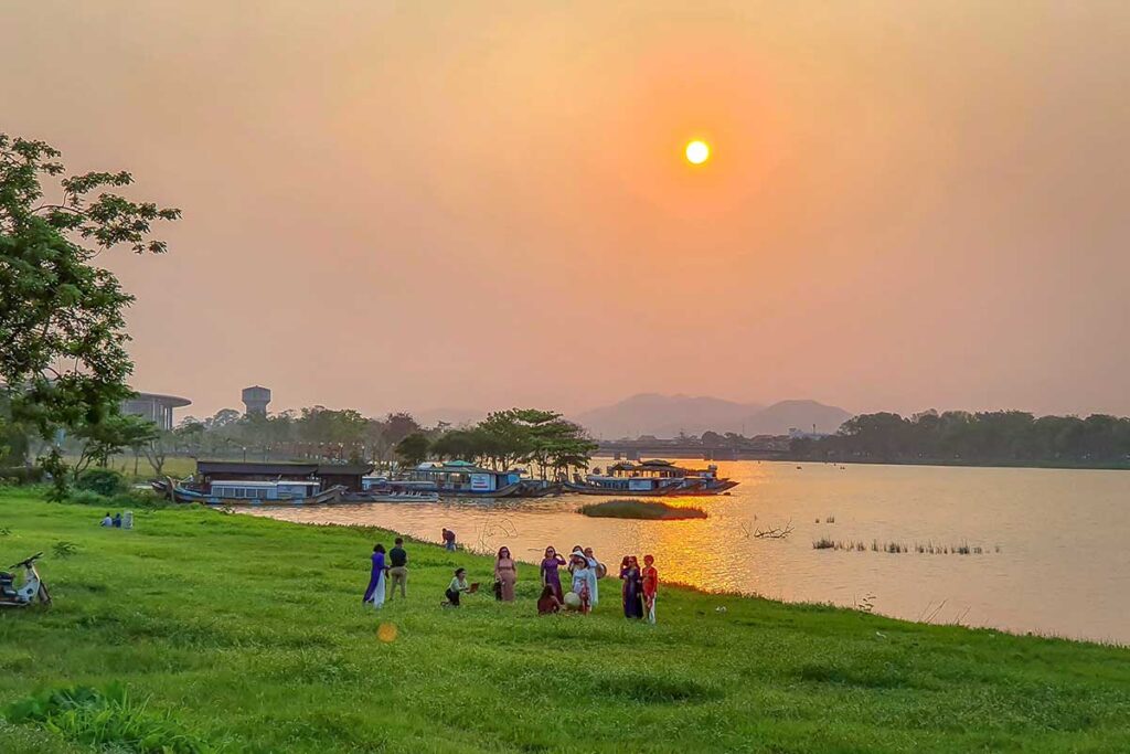 Hue in March - Locals watching the sunset at the Perfume River