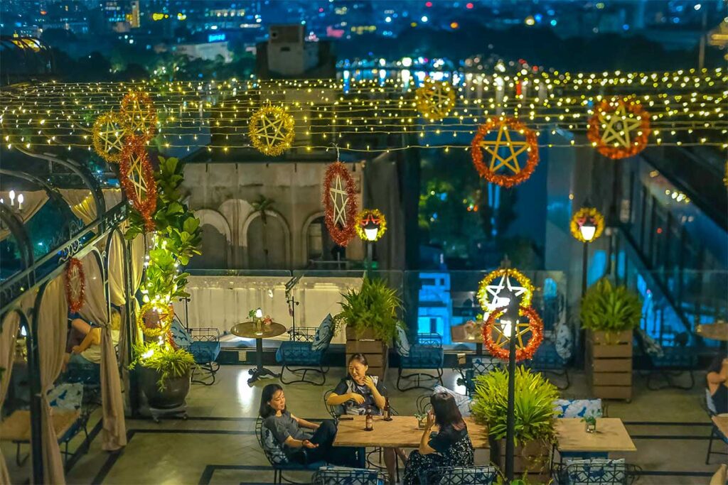 A cafe with a rooftop in Hanoi has simple Mid Autumn decorations with light burning in the evening