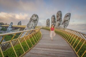 Ba Na Hills Day Tour – walking on the famous Golden Bridge held by giant stone hands at Sun World Ba Na Hills, Da Nang
