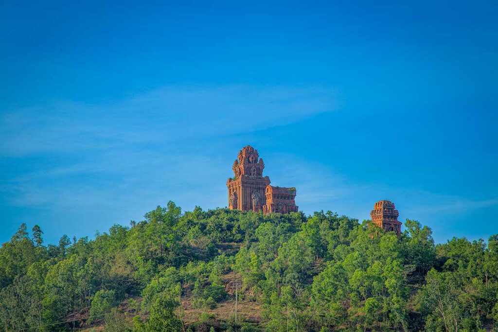 Banh It Cham Towers on a green hilltop near Quy Nhon, Binh Dinh, Vietnam.