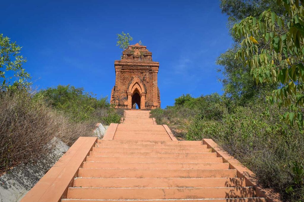 Gopura gate tower and stairway leading up to the Banh It Cham Towers complex.