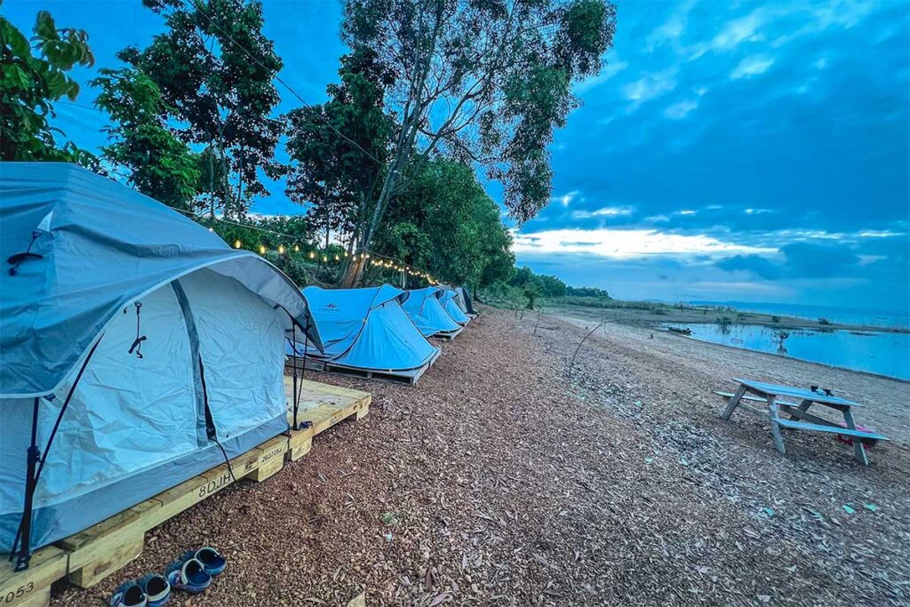A campsite right at the edge of Tri An Lake