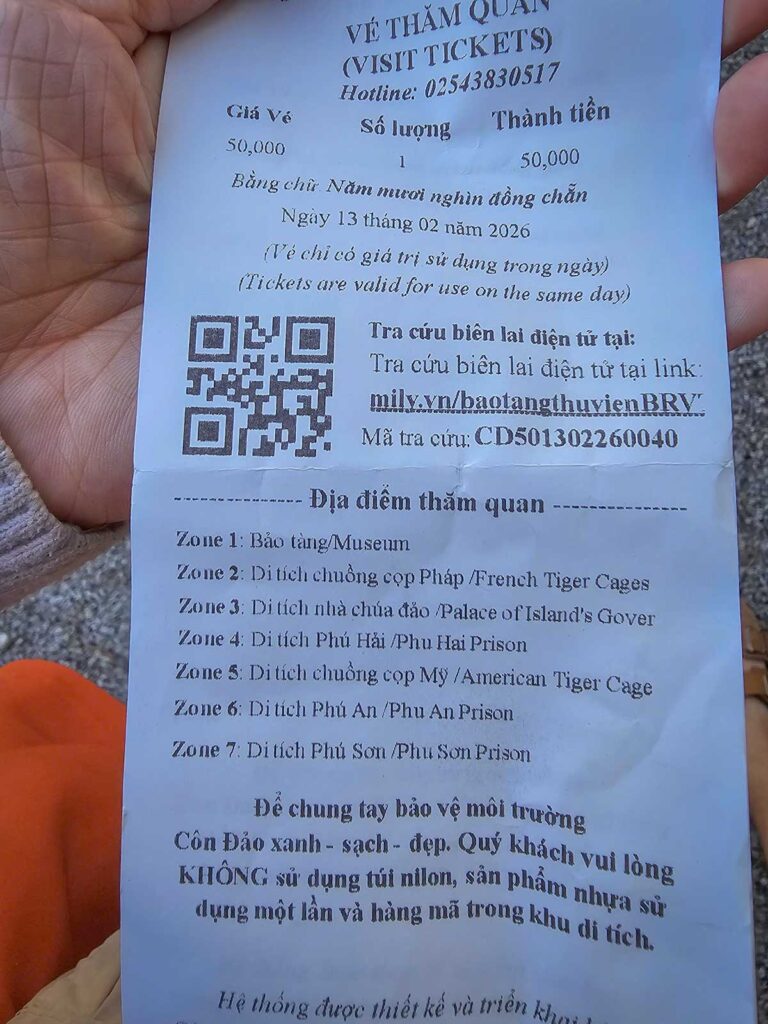 Entrance ticket for the Con Dao prison complex showing the seven zones, including the museum, French and American tiger cages, and main prison camps on Con Dao Island.