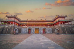 Sunset view of the Imperial City in Hue, featuring the beautifully lit Ngo Mon Gate and historic royal architecture.