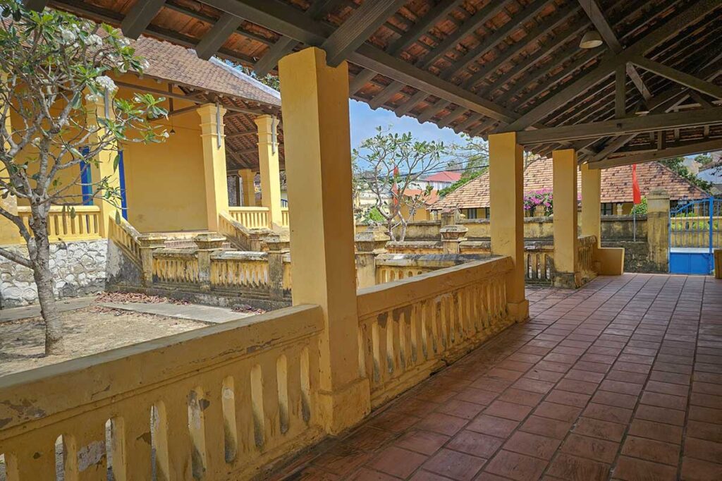 Covered walkway and courtyard at the Palace of the Island Governor in Con Dao, showing colonial architecture and the administrative center of the Con Dao prison system.