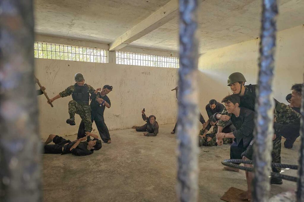 Reconstruction of prisoners and guards inside a cell at Phu An Prison on Con Dao, illustrating harsh treatment and conditions during detention.