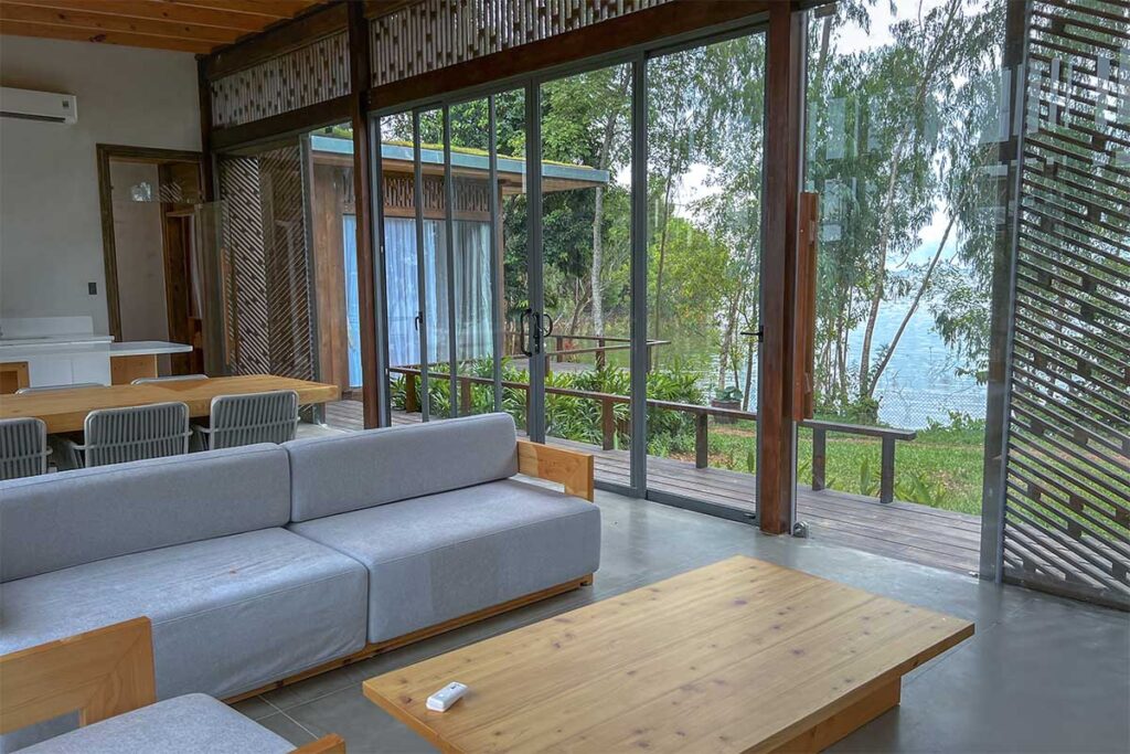 The inside of a villa part of a retreat overlooking Tri An Lake