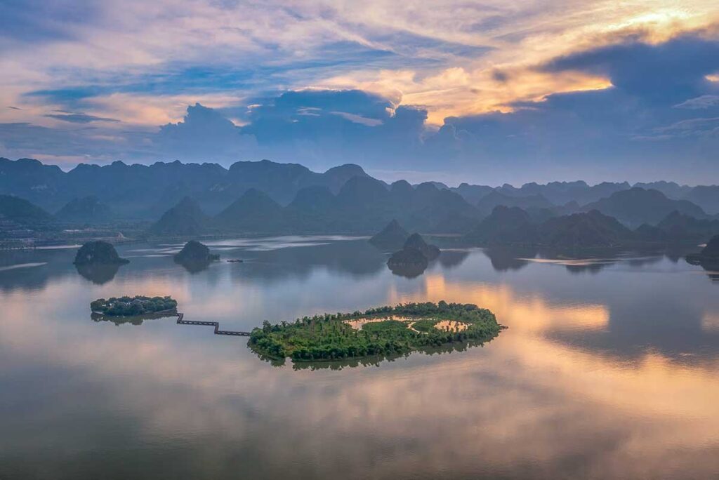 Aerial view of Tam Chuc Communal House on an island in a lake of Tam Chuc Pagoda Complex