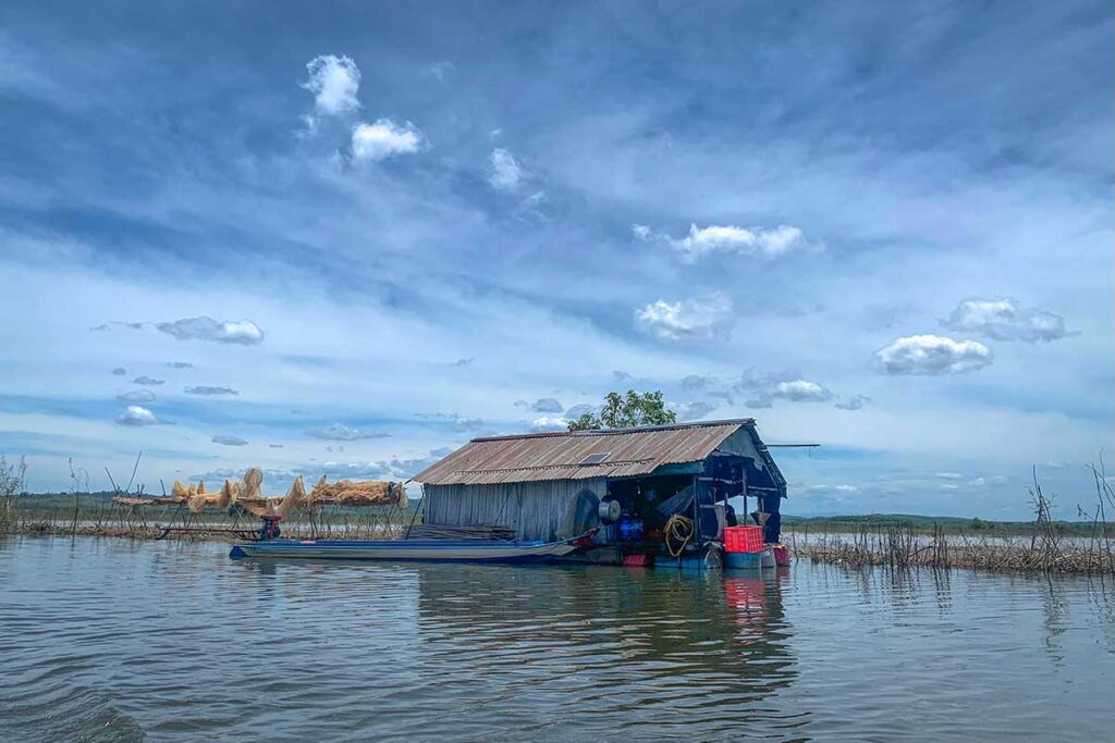 A floating house of local fisherman on Tri An Lake