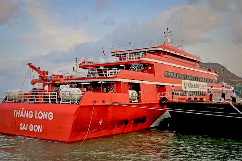Red Con Dao Express ferry docked at Vung Tau port ready for departure to Con Dao with passengers boarding