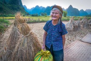 A local woman standing on a countryside path in Cao Bang