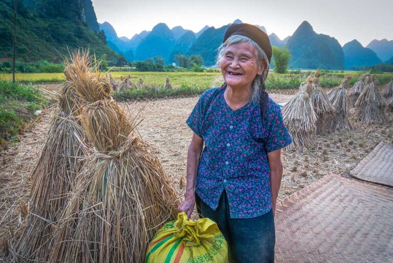A local woman standing on a countryside path in Cao Bang