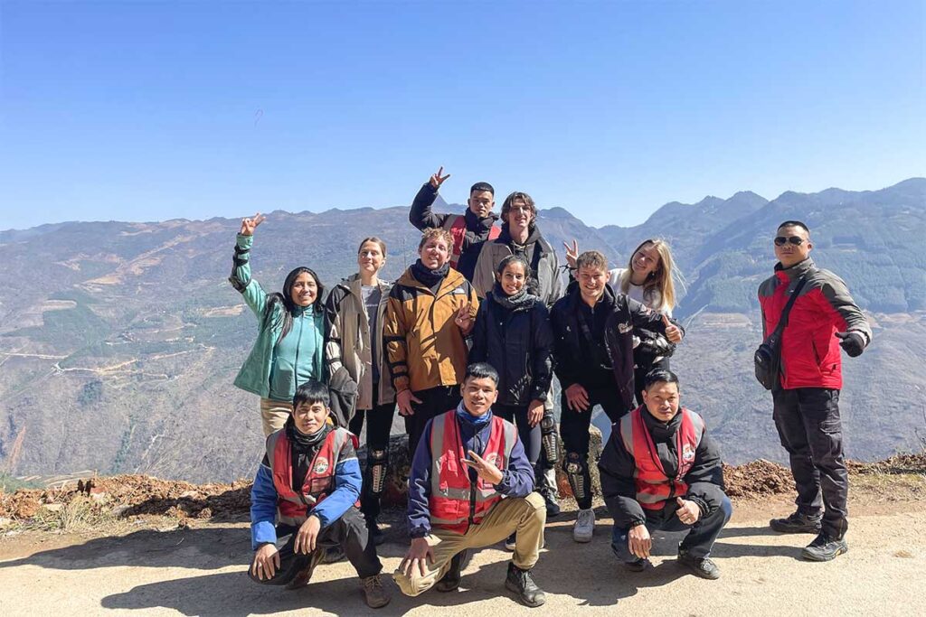 Group photo at Ha Giang viewpoint during Easy Rider motorbike tour