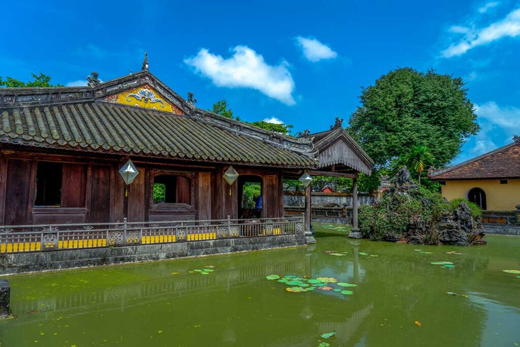 A small lelie pond and historical building of Dien Tho Palace within Hue Imperial City