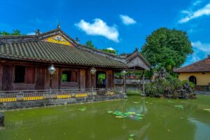 A small lelie pond and historical building of Dien Tho Palace within Hue Imperial City
