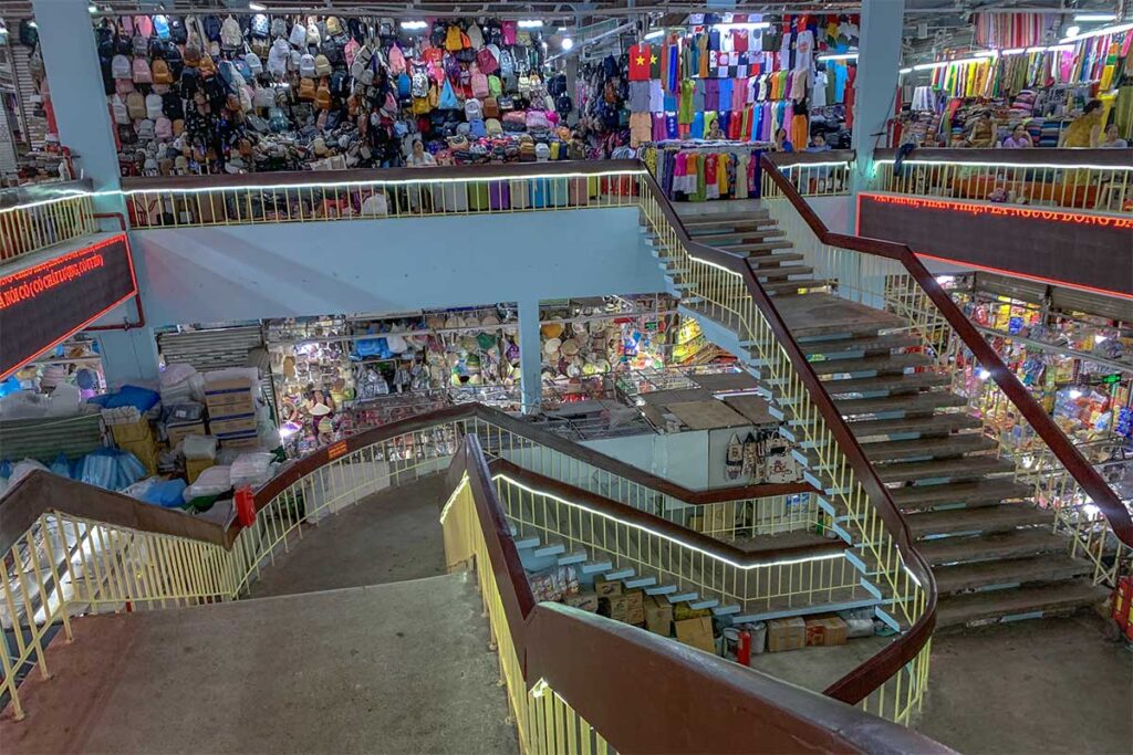Stairs inside Dong Ba Market seen from the second floor looking down