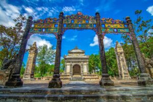 Three entrance gate with behind a tomb building at Dong Khanh Tomb in Hue