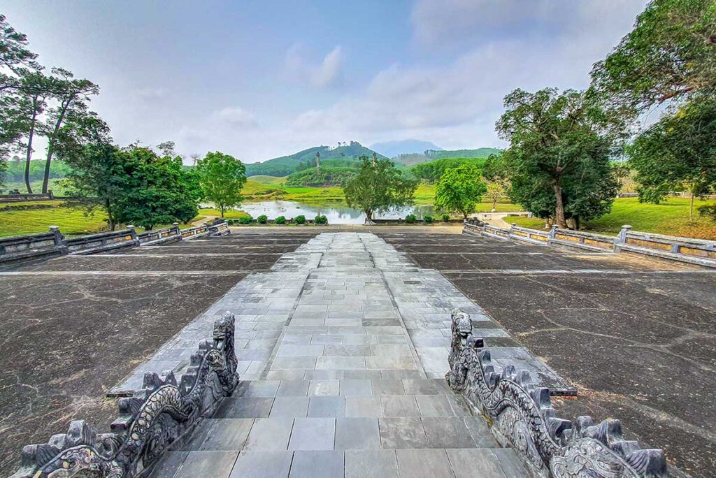 Tiered stone levels with a stairway leading up to the main area of the twin Tombs of Emperor Gia Long and Empress Thừa Thiên