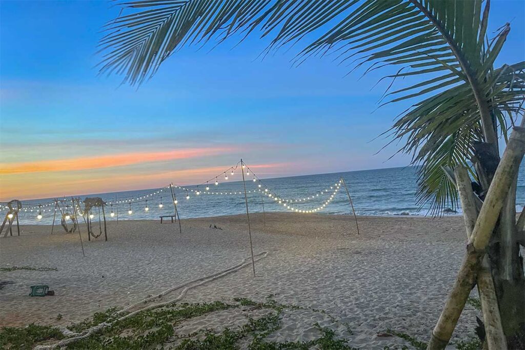 Ham Rong Beach in the evening with lights hanging on poles