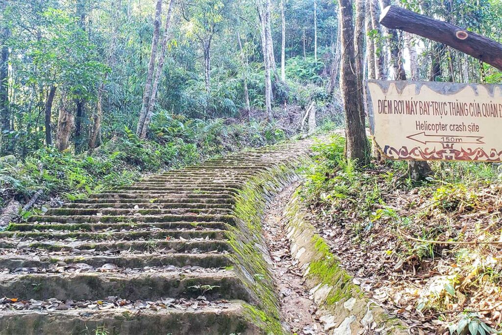 Stairs leading up to Hamburger Hill with a sign saying " Helicopter Crash Site"