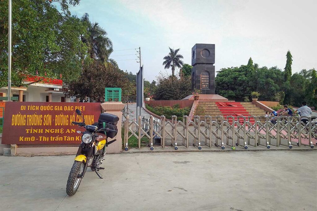 Motorbike parked at the Km 0 starting point of the Ho Chi Minh Road in Nghe An, marking the beginning of the historic Truong Son route