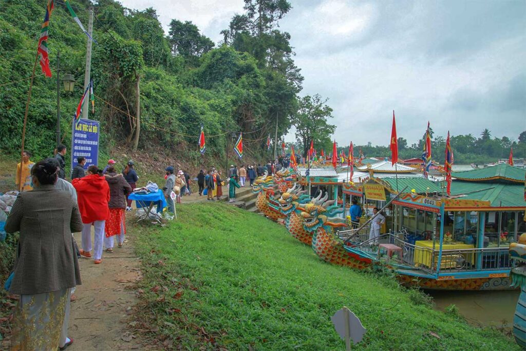 Lots of dragon boats and traditional flags along the river of Hon Chen temple for Hon Chen Festival