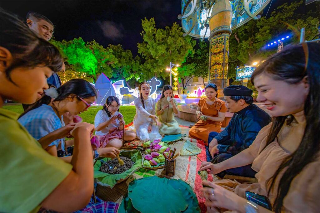 Locals on the street of Hue preparing traditional food during Hue Festval