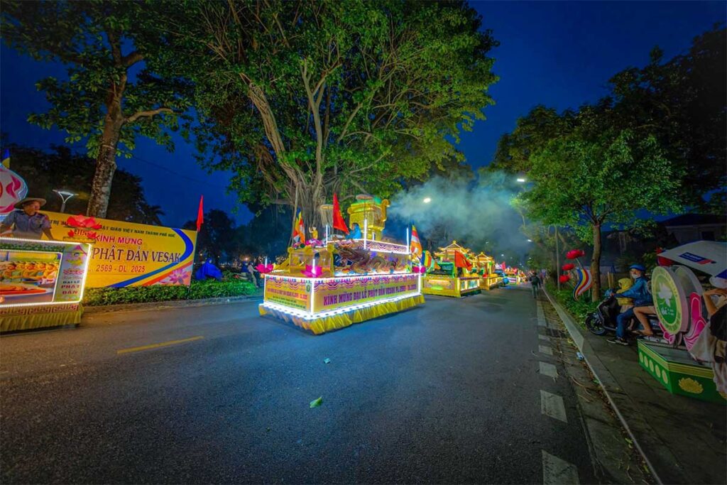 A night time parade with decorated cards with LED lightning during Hue Festival